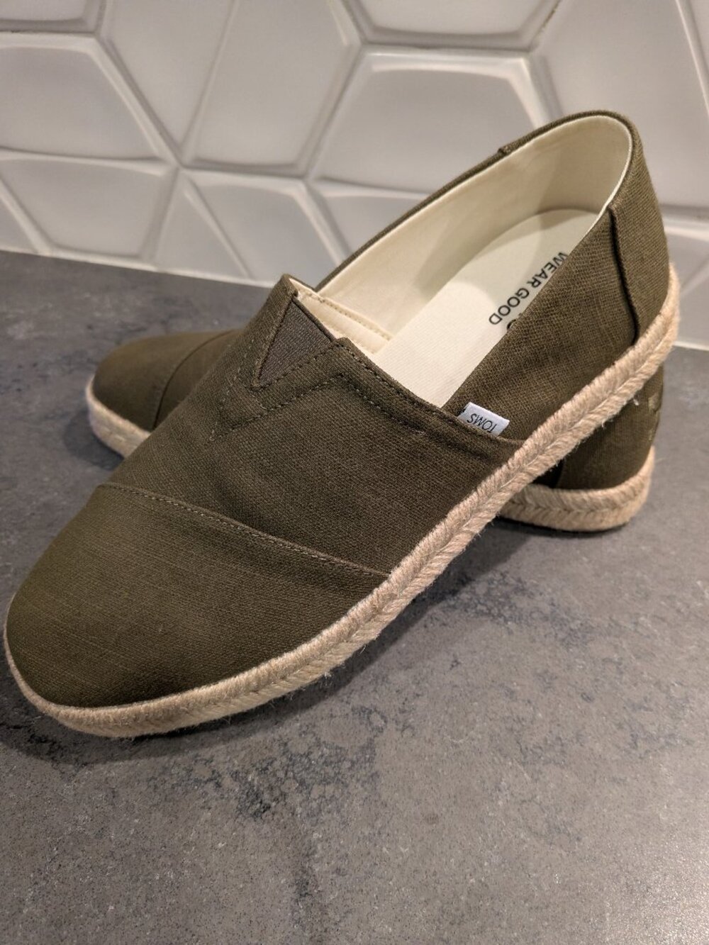 2 pairs of Men's Toms shoes one brand new one used once !
